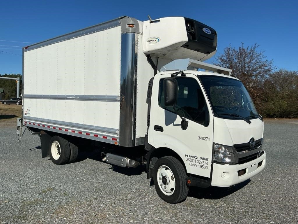 Side View of a white fridge truck
